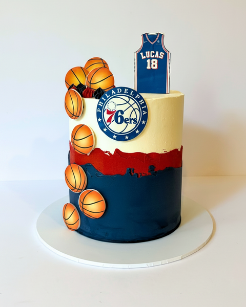 Cake decorated with basketball theme and Philadelphia 76ers logo