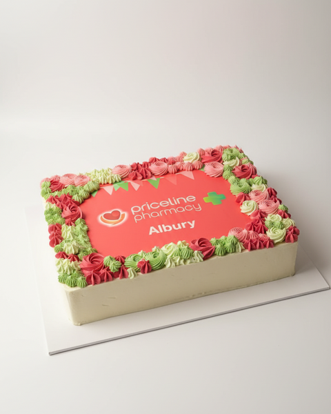 A slab cake with green and red frosting designed to look like a logo, 