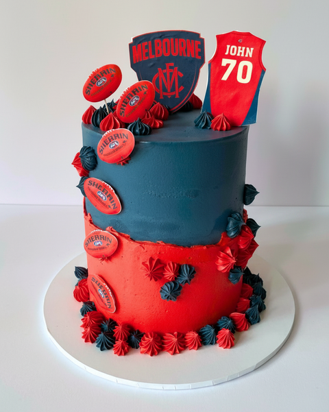  cake decorated with Melbourne Football Club branding and a sports jersey.