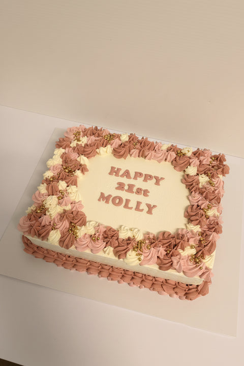 Sheet cake with pink and white frosting 